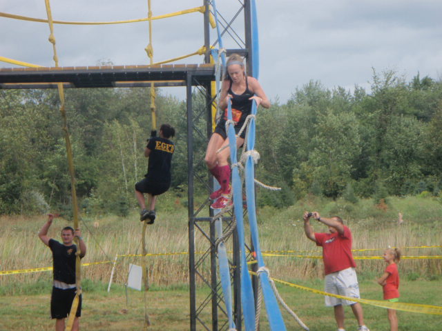 Heather Hart attempts to balance on a fire hose obstacle during the 2012 Hero Rush Obstacle Course Race