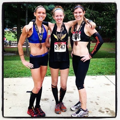 Amelia Boone, Heather Heart,  Holly Joy Berkey posing wearing race medals after the Mud Guts and Glory OCR