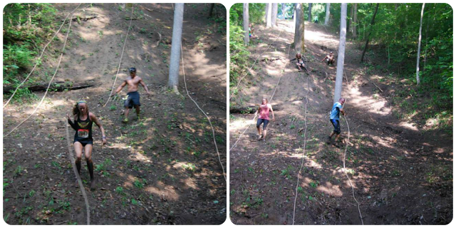 Image of Obstacle Course Racers going up and down a hill using ropes to help climb 