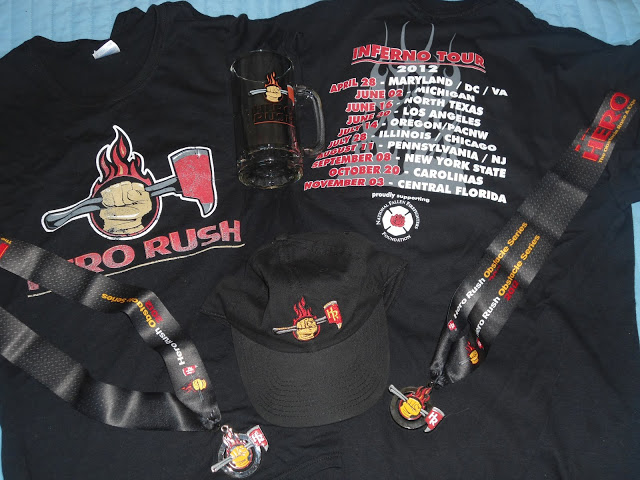 image of t-shirts, finishers medals, a hat, and a beer stein all bearing the 2012 Hero Rush Obstacle Course Race logo