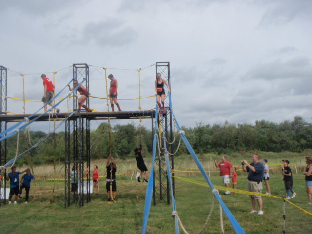 view of athletes climbing and balancing down ropes and fire hose during an obstacle at the 2012 Hero Rush Obstacle Course Race