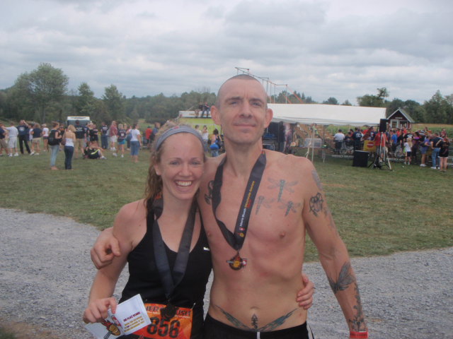 Heather and Geoffrey Hart smiling and posing for a photo at the end of the 2012 Hero Rush Obstacle Course Race