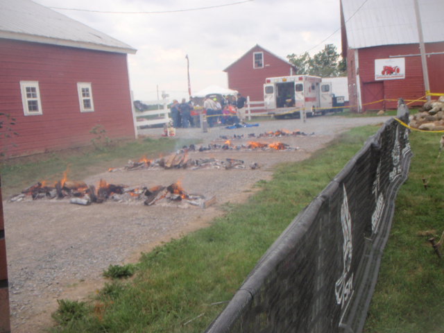 Image of four rows of logs on fire for participants to jump over during the 2012 Hero Rush Obstacle Course Race