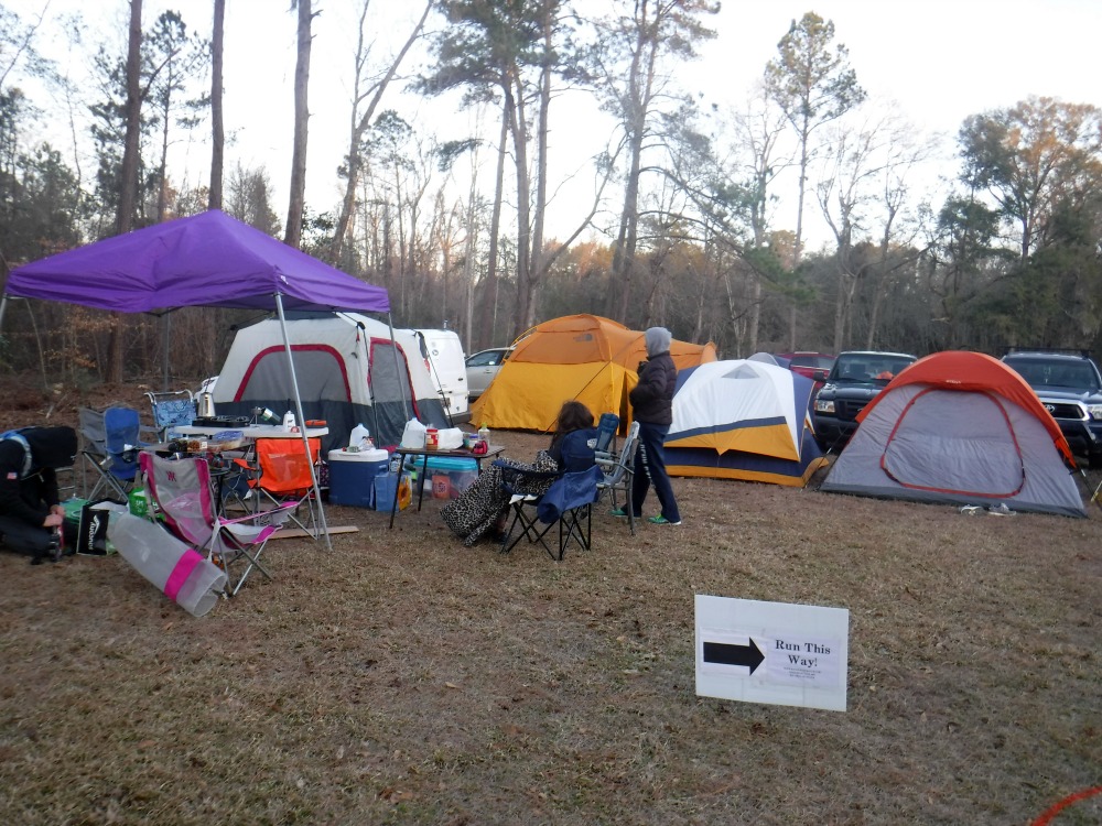 Group of tents set up very close together while camping before a trail race