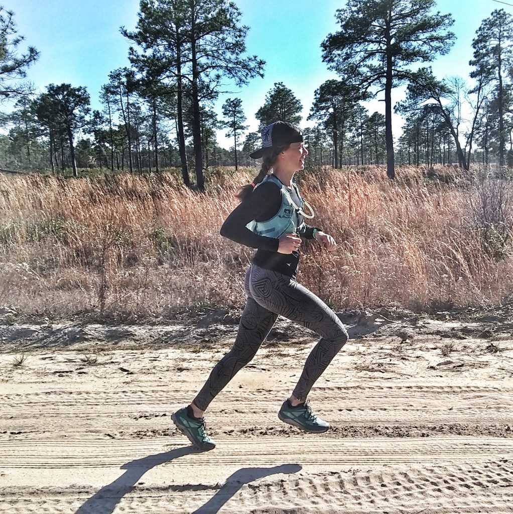 Heather Hart running down a dirt road. 