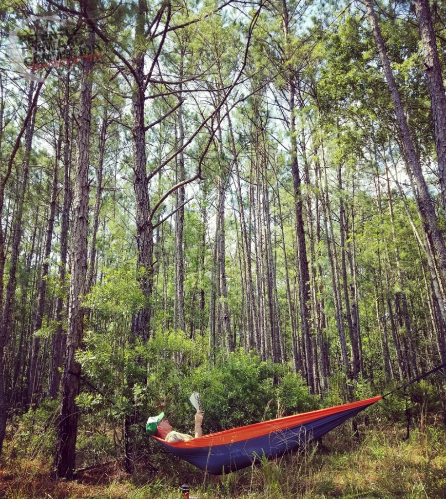 A runner relaxes in a hammock.  Rest days are in integral part of avoiding overreaching and overtraining in runners