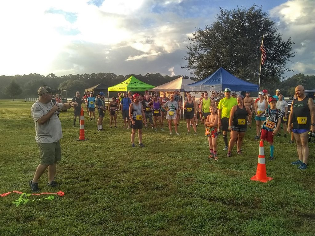 Race Director Chad Haffa of Eagle Endurance giving instructions to runners before the Dirt Dash looped race course 