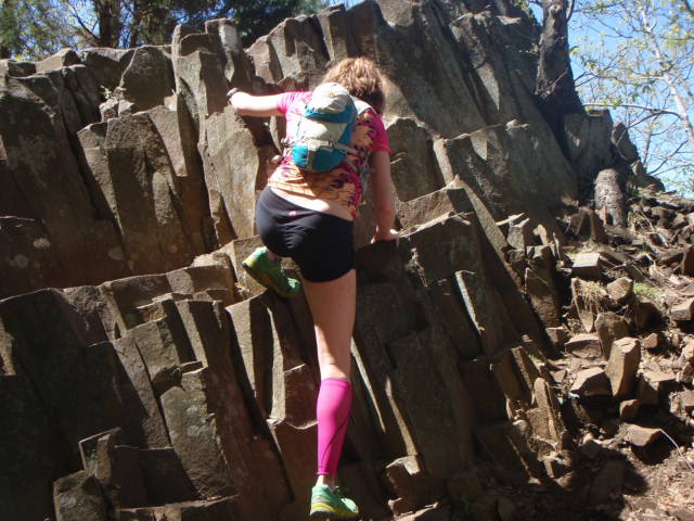 Heather Hart Climbing rocks during 7 Sisters Trail Race