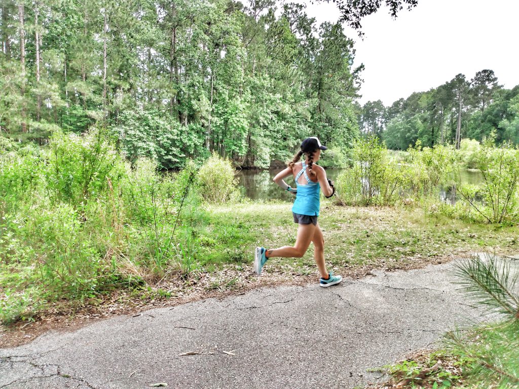 Heather Hart running down paved path