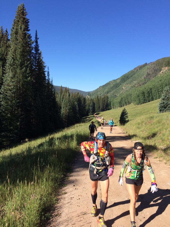 Geoff Hart and Heather Hart climbing hill during TransRockies Run 6 day stage race