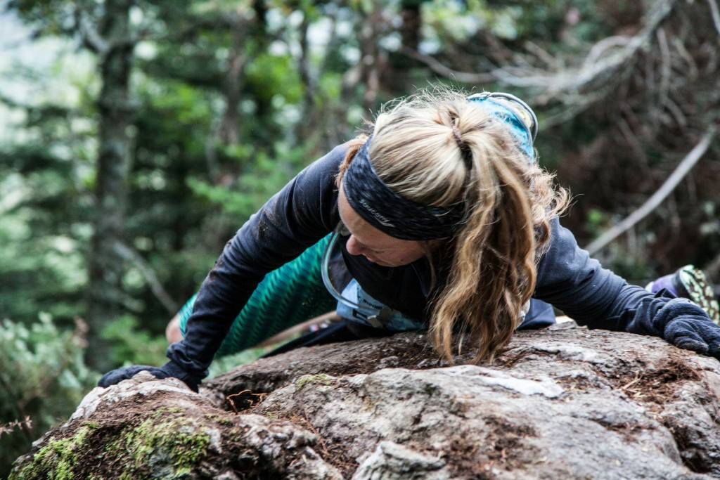 Heather Hart climbing a rock during o2X race