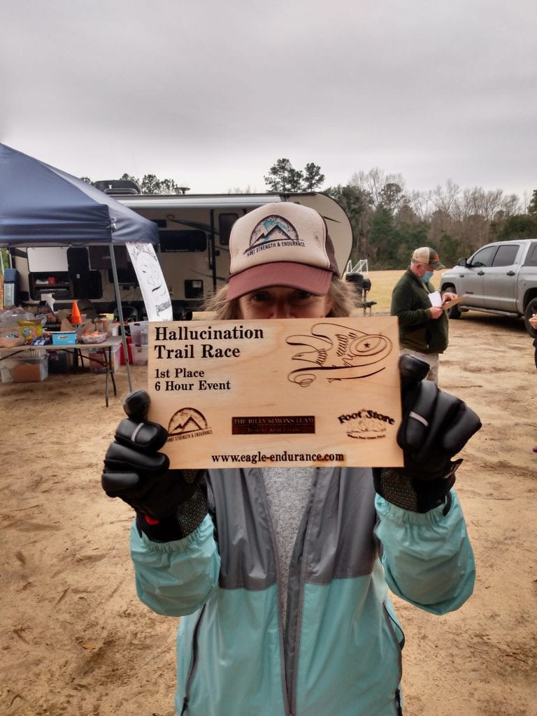 Heather Hart with first place trophy at the 2021 Hallucination 6 12 24 hour trail 