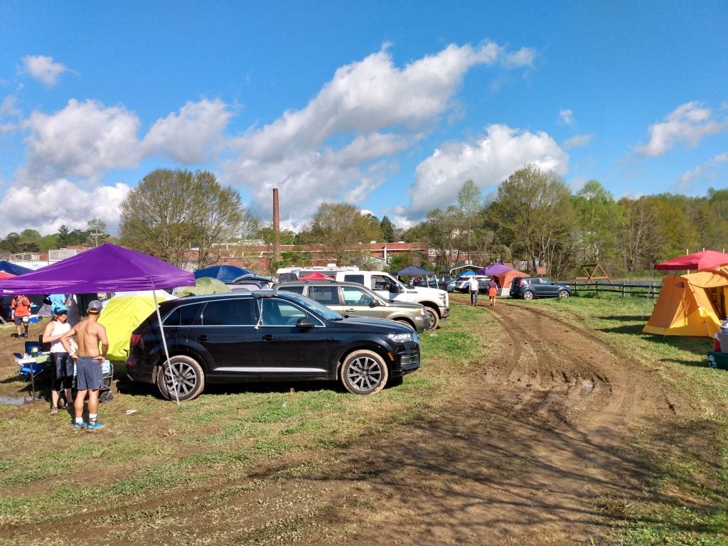 runners and tents crowded around a race course before The Country Mile race