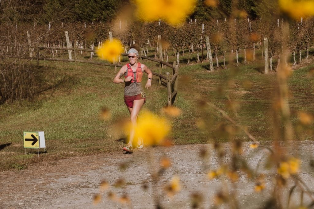 Heather Hart trail running during a race