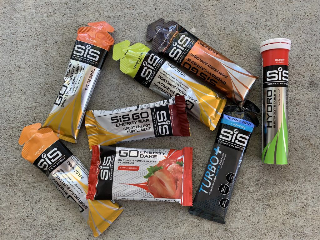 An assortment of Science in Sport nutrition options, gels, energy bars, and hydration tablets 
