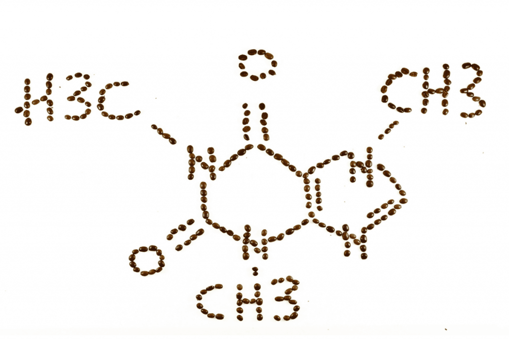 Picture of the chemical symbol for caffeine made out of coffee beans