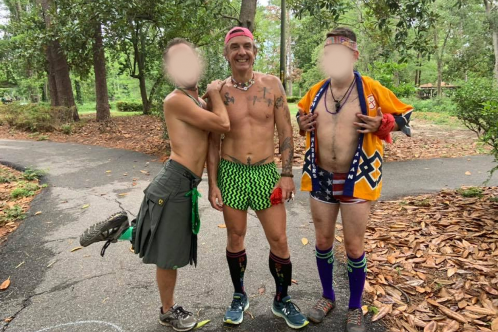 Three hashers from the hash house harriers pose for a picture