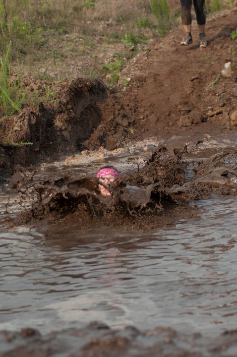 2011 Myrtle Beach Mud  Run Participant Heather Hart dives into a mud pit