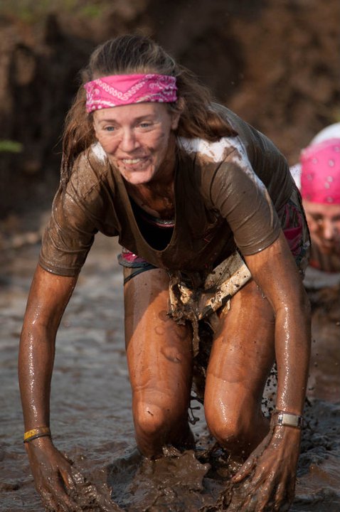 2011 Myrtle Beach Mud  Run Participant Heather Hart crawls out of a mud pit