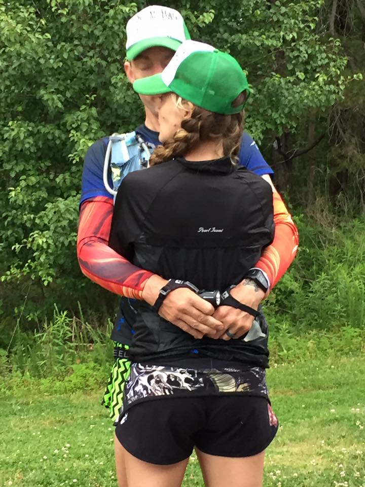 Heather and Geoff Hart hugging before the start of an ultramarathon 