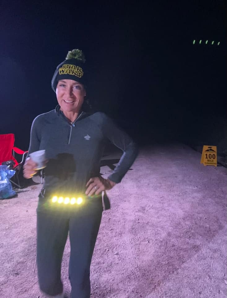 Ultrarunner Christina Matthews wearing the  Kogalla lighting system during a race