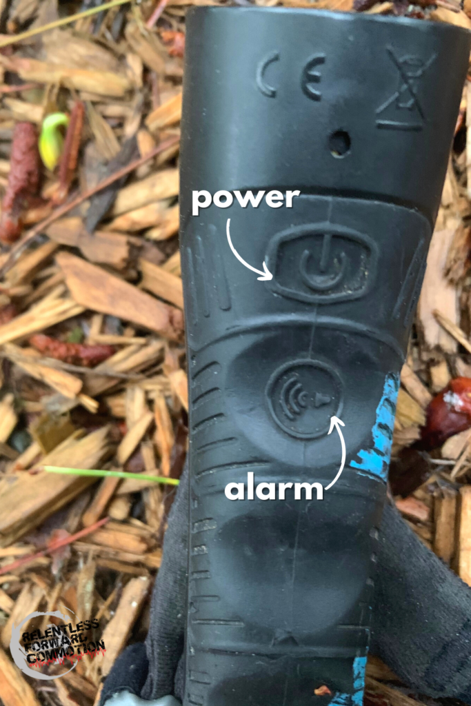 Power and alarm button on the Nathan Terra Fire Hand Torch