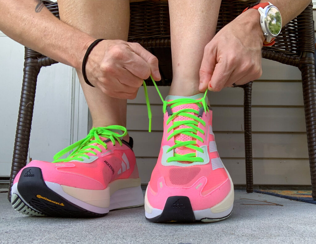 Runner ties their running shoes before heading out for a run