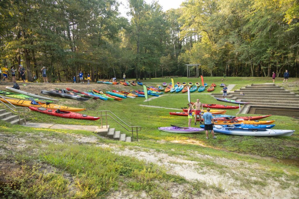 Image of kayaks lined up on the shore before the start of the 2022 KFB Lynches River Adventure Race
