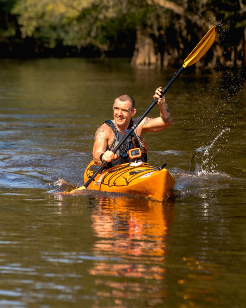 Geoffrey Hart paddling a kayak during the 2022 KFB Lynches River Adventure Race