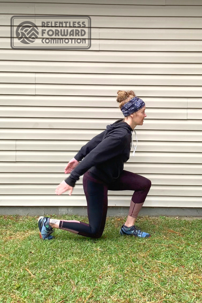 Heather Hart demonstrating the amortization phase of a cycled split squat plyometric exercise 