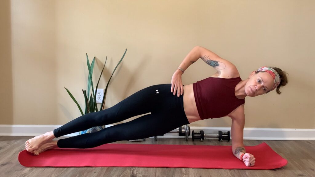 Heather Hart performs a side plank exercise 