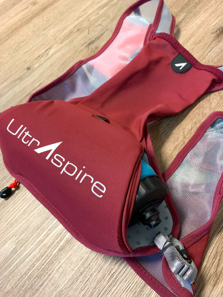Insulated bottle compartment on the UltrAspire Basham Race Vest