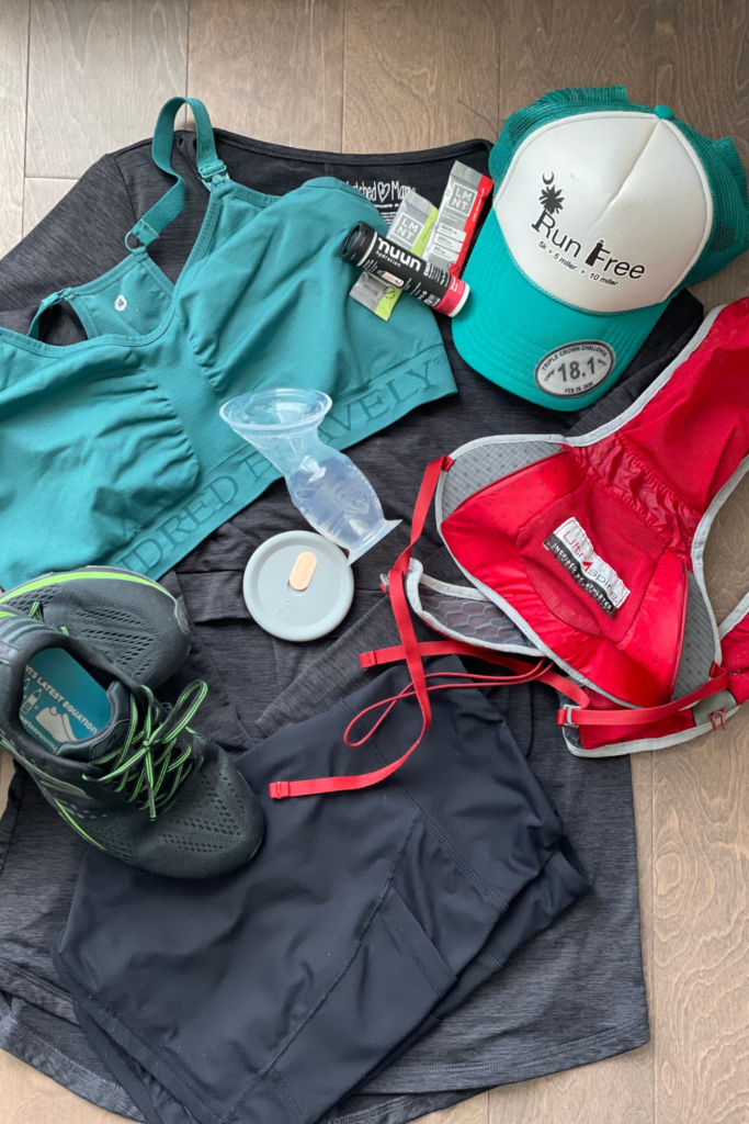 Image of a nursing bra and breast-feeding pump mixed in with ultrarunning gear: shoes, hydration pack, nutrition, and more. 
