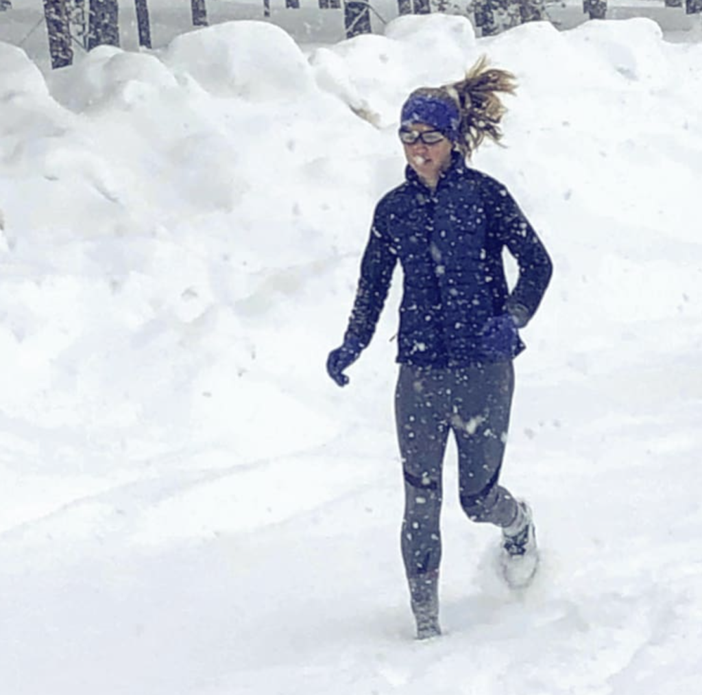  Lexi Miller running through snow in her hometown of Leadville, Co.